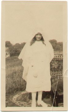 My grandmother Mary in her first communion dress